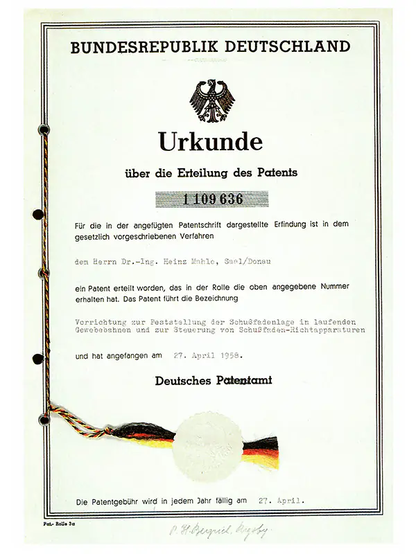 Patent der automatischen Schussfadenrichtmaschine von Dr. Heinz Mahlo (1958) Patenturkunde für die automatische Schussfadenrichtmaschine von Dr. Heinz Mahlo mit Patentnummer 1109636.